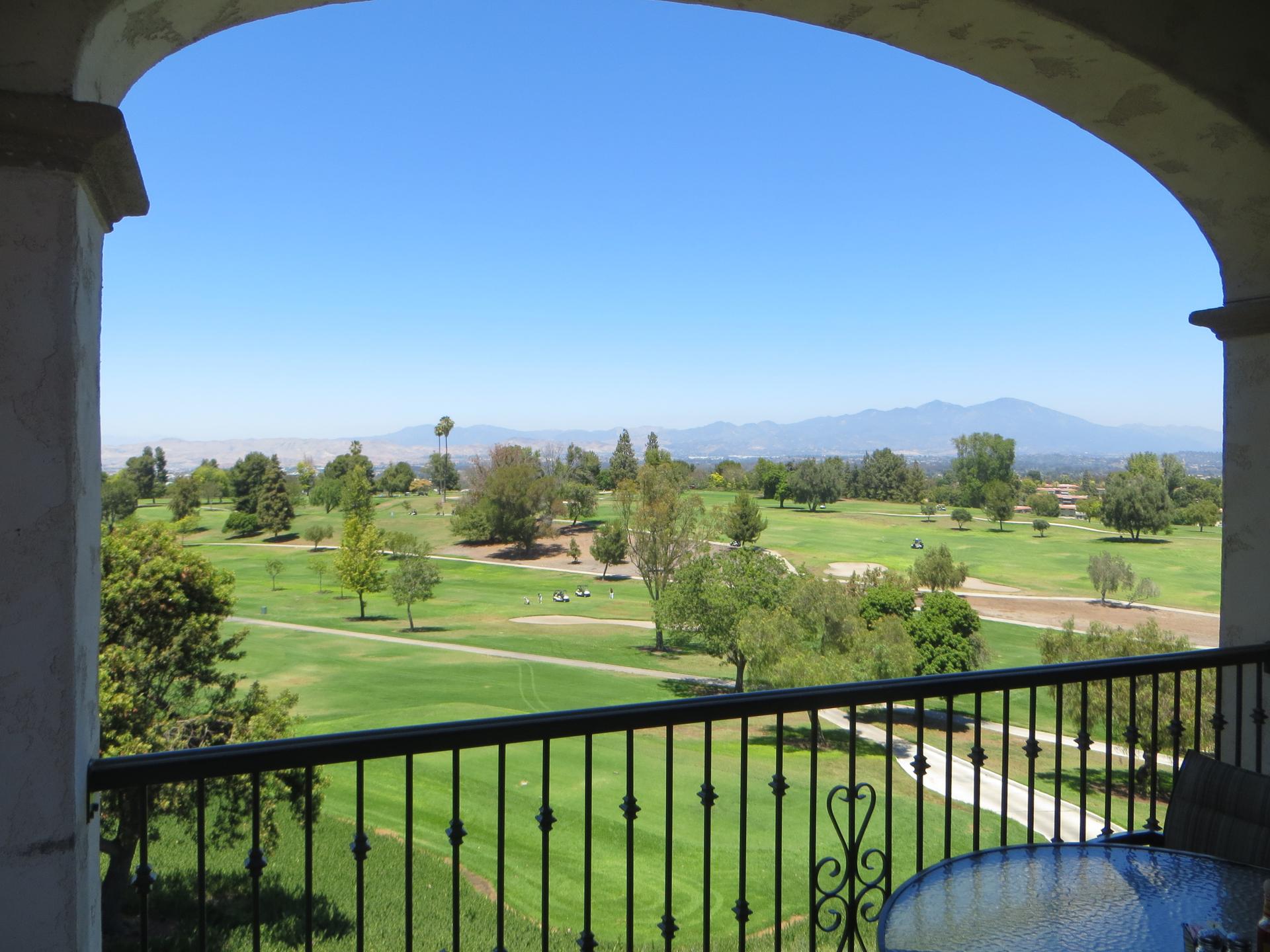 Laguna Woods Village: Golf course view through a clubhouse arch